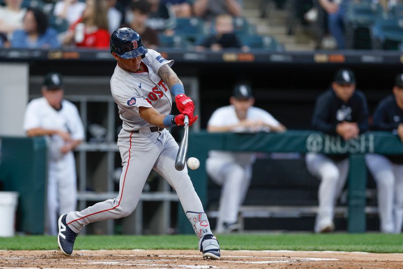 Jun 6, 2024; Chicago, Illinois, USA; Boston Red Sox outfielder Ceddanne Rafaela (43) hits a two-run single against the Chicago White Sox during the second inning at Guaranteed Rate Field. Mandatory Credit: Kamil Krzaczynski-USA TODAY Sports