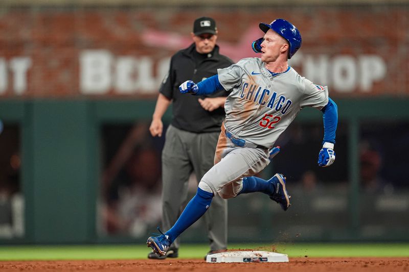 May 15, 2024; Cumberland, Georgia, USA; Chicago Cubs center fielder Pete Crow-Armstrong (52) runs after hitting a triple against the Atlanta Braves during the eight inning at Truist Park. Mandatory Credit: Dale Zanine-USA TODAY Sports