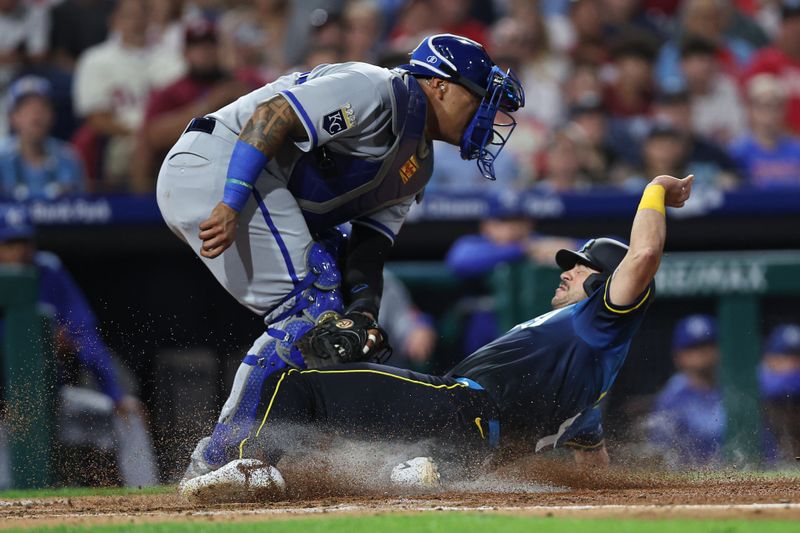 Sep 12, 2025; Philadelphia, Pennsylvania, USA; Kansas City Royals catcher Salvador Perez (13) tags out Philadelphia Phillies first base Otto Kemp (4) at home plate during the third inning at Citizens Bank Park. Mandatory Credit: Bill Streicher-Imagn Images