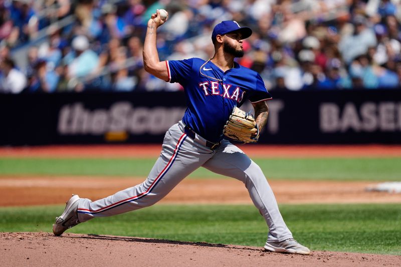 Jul 28, 2024; Toronto, Ontario, CAN; Texas Rangers pitcher Jonathan Hernandez (72) pitches to the Toronto Blue Jays during the first inning at Rogers Centre. Mandatory Credit: John E. Sokolowski-USA TODAY Sports