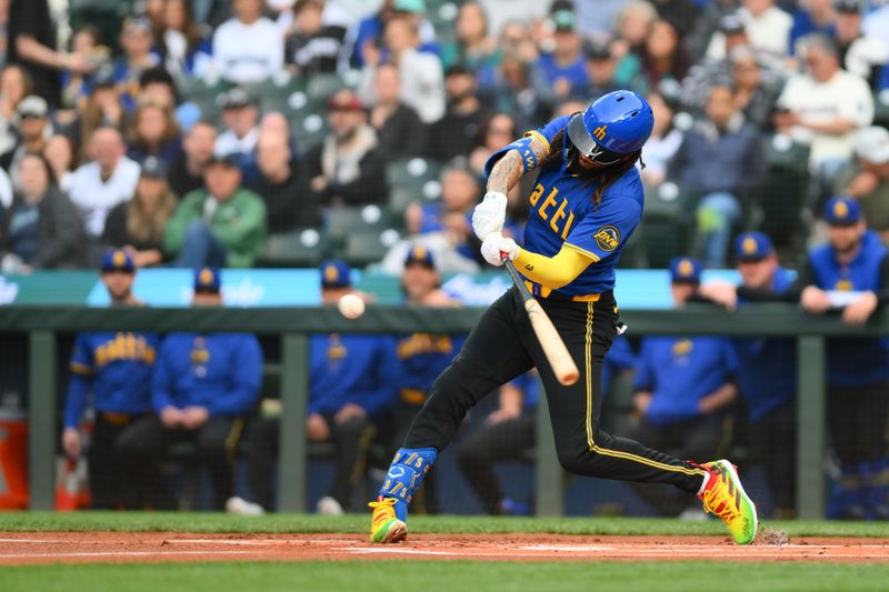 May 31, 2024; Seattle, Washington, USA; Seattle Mariners shortstop J.P. Crawford (3) hits a double against the Los Angeles Angels during the first inning at T-Mobile Park. Mandatory Credit: Steven Bisig-USA TODAY Sports