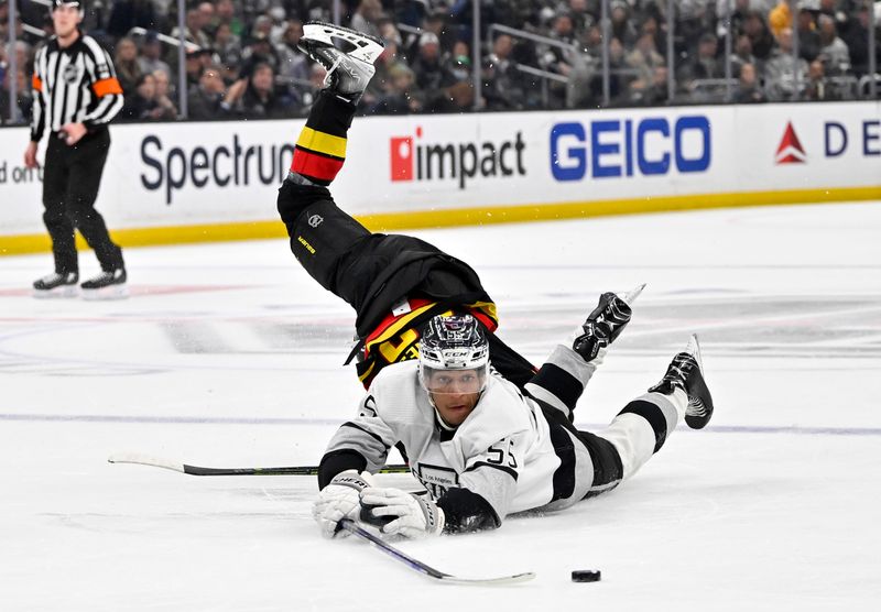 Apr 10, 2023; Los Angeles, California, USA;  Los Angeles Kings center Quinton Byfield (55) reaches for the puck in front of Vancouver Canucks defenseman Quinn Hughes (43) in the third period at Crypto.com Arena. Mandatory Credit: Jayne Kamin-Oncea-USA TODAY Sports