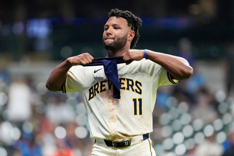 Aug 27, 2024; Milwaukee, Wisconsin, USA;  Milwaukee Brewers left fielder Jackson Chourio (11) reacts after striking out to end the eighth inning against the San Francisco Giants at American Family Field. Mandatory Credit: Jeff Hanisch-USA TODAY Sports