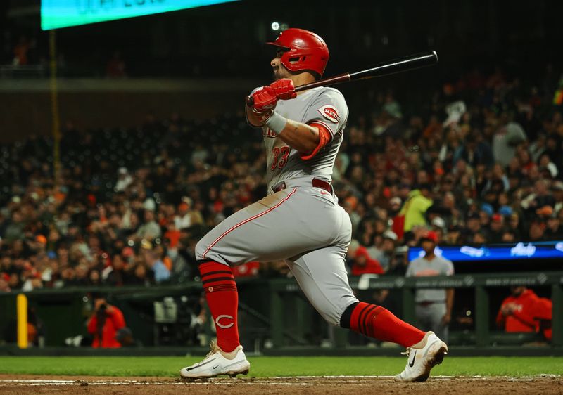 Aug 28, 2023; San Francisco, California, USA; Cincinnati Reds first baseman Christian Encarnacion-Strand (33) hits a double against the San Francisco Giants during the seventh inning at Oracle Park. Mandatory Credit: Kelley L Cox-USA TODAY Sports