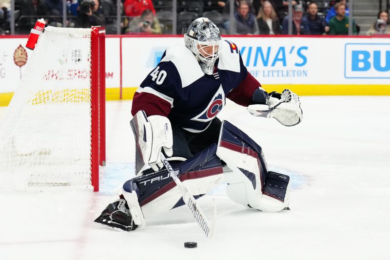 Dec 7, 2023; Denver, Colorado, USA; Colorado Avalanche goaltender Alexandar Georgiev (40) makes a save in the first period against the Winnipeg Jets at Ball Arena. Mandatory Credit: Ron Chenoy-USA TODAY Sports