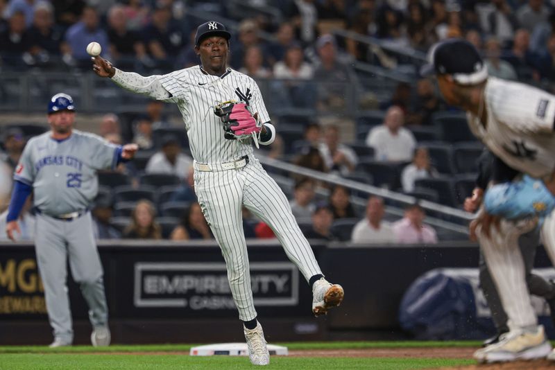 Sep 10, 2024; Bronx, New York, USA; New York Yankees third baseman Jazz Chisholm Jr. (13) throws the ball first base during the fifth inning against the Kansas City Royals at Yankee Stadium. Mandatory Credit: Vincent Carchietta-Imagn Images