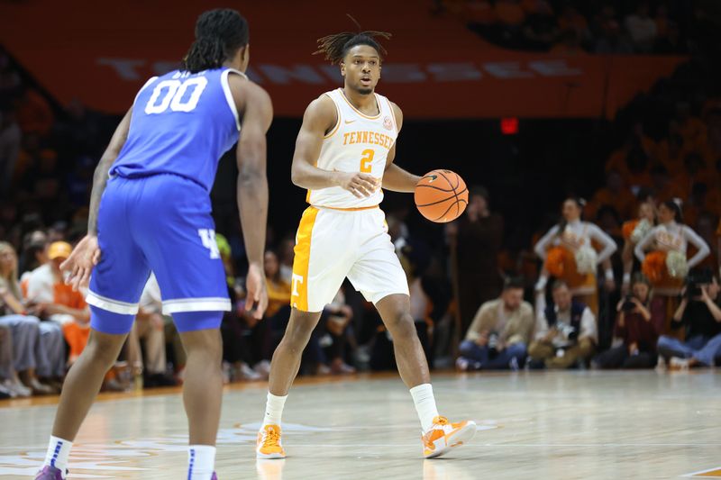 Jan 28, 2025; Knoxville, Tennessee, USA; Tennessee Volunteers guard Chaz Lanier (2) moves the ball against Kentucky Wildcats guard Otega Oweh (00) during the first half at Thompson-Boling Arena at Food City Center. Mandatory Credit: Randy Sartin-Imagn Images