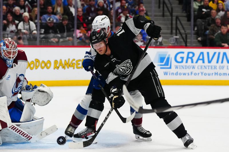 Dec 29, 2025; Denver, Colorado, USA; Colorado Avalanche goaltender Mackenzie Blackwood (39) and defenseman Devon Toews (7) defend on Los Angeles Kings right wing Corey Perry (10) in the third period at Ball Arena. Mandatory Credit: Ron Chenoy-Imagn Images