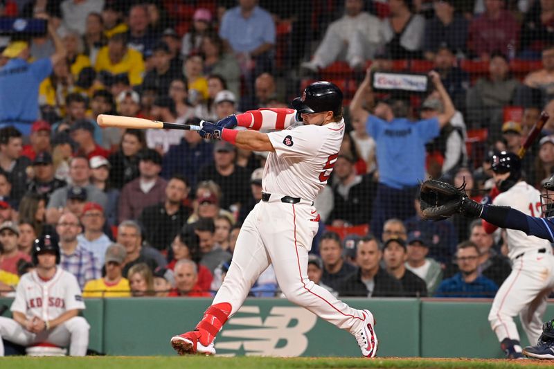 May 15, 2024; Boston, Massachusetts, USA; Boston Red Sox right fielder Wilyer Abreu (52) hits a home run against the Tampa Bay Rays during the fourth inning at Fenway Park. Mandatory Credit: Eric Canha-USA TODAY Sports