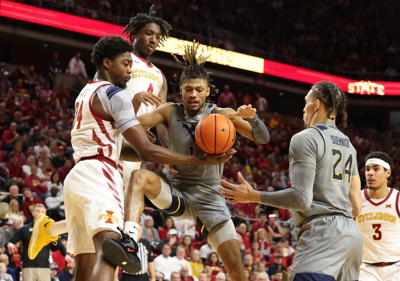 Feb 24, 2024; Ames, Iowa, USA; West Virginia Mountaineers guard Noah Farrakhan (1) battles for a loose ball against Iowa State Cyclones guard Demarion Watson (4) and forward Hason Ward (24) during the second half at James H. Hilton Coliseum. Mandatory Credit: Reese Strickland-USA TODAY Sports