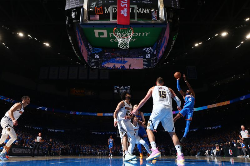 OKLAHOMA CITY, OK - MAY 18: Shai Gilgeous-Alexander #2 of the Oklahoma City Thunder shoots the ball during the game against the Denver Nuggets  during Round 2 Game 7 of the 2025 NBA Playoffs on May 18, 2025 at Paycom Center in Oklahoma City, Oklahoma. NOTE TO USER: User expressly acknowledges and agrees that, by downloading and or using this photograph, User is consenting to the terms and conditions of the Getty Images License Agreement. Mandatory Copyright Notice: Copyright 2025 NBAE (Photo by Zach Beeker/NBAE via Getty Images)