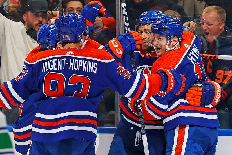 Oct 14, 2023; Edmonton, Alberta, CAN; The Edmonton Oilers celebrate a goal scored by forward Leon Draisaitl (29) during the first period against the Vancouver Canucks at Rogers Place. Mandatory Credit: Perry Nelson-USA TODAY Sports