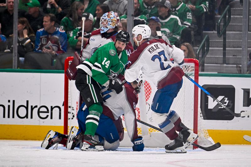 Mar 6, 2026; Dallas, Texas, USA; Dallas Stars left wing Jamie Benn (14) and Colorado Avalanche defenseman Brett Kulak (27) look for the puck during the third period at the American Airlines Center. Mandatory Credit: Jerome Miron-Imagn Images