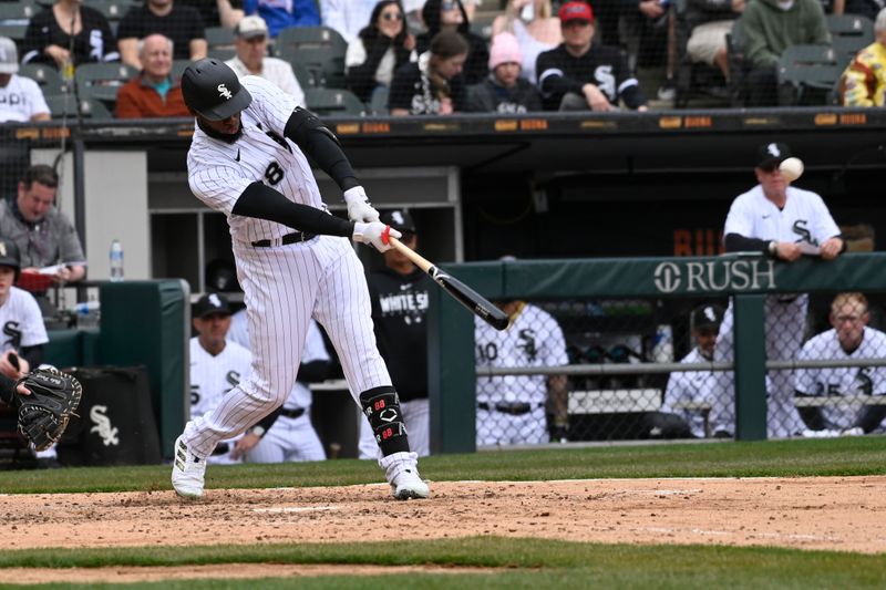 Apr 5, 2023; Chicago, Illinois, USA;  Chicago White Sox center fielder Luis Robert Jr. (88) hits an RBI double against the San Francisco Giants during the fifth inning at Guaranteed Rate Field. Mandatory Credit: Matt Marton-USA TODAY Sports