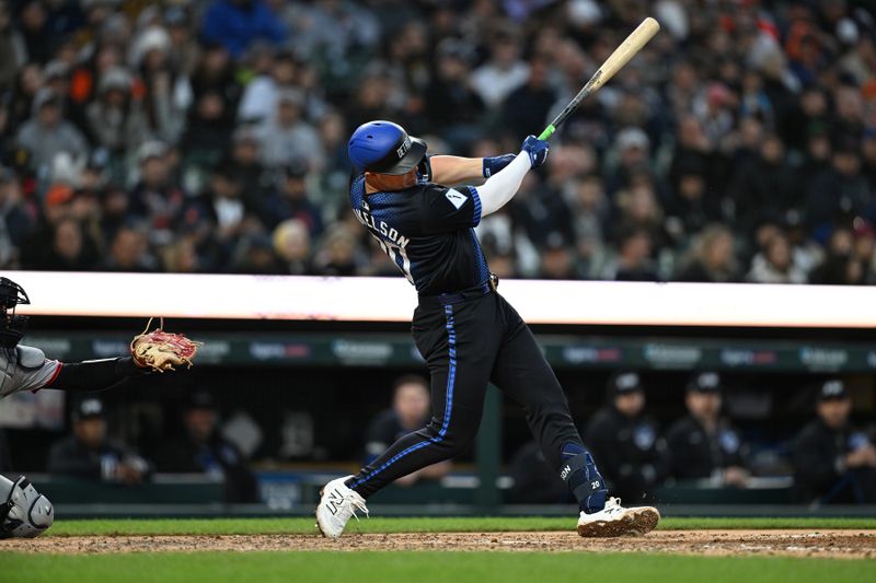 May 23, 2025; Detroit, Michigan, USA; Detroit Tigers first baseman Spencer Torkelson (20) hits a solo home run against the Cleveland Guardians in the sixth inning at Comerica Park. Mandatory Credit: Lon Horwedel-Imagn Images