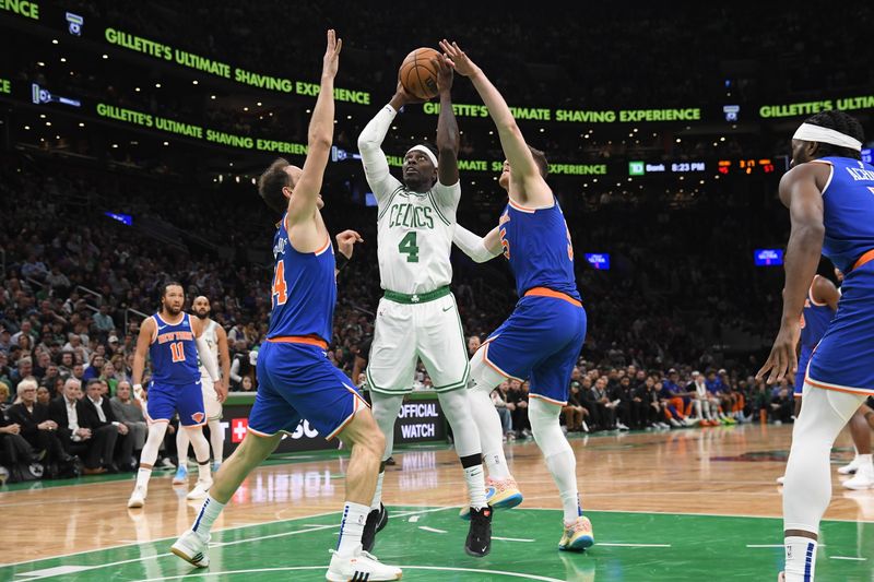 BOSTON, MA - APRIL 11: Jrue Holiday #4 of the Boston Celtics drives to the basket during the game against the New York Knicks on April 11, 2024 at the TD Garden in Boston, Massachusetts. NOTE TO USER: User expressly acknowledges and agrees that, by downloading and or using this photograph, User is consenting to the terms and conditions of the Getty Images License Agreement. Mandatory Copyright Notice: Copyright 2024 NBAE  (Photo by Brian Babineau/NBAE via Getty Images)