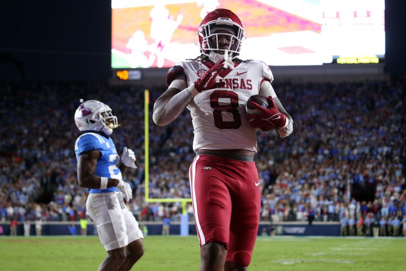 Oct 7, 2023; Oxford, Mississippi, USA; Arkansas Razorbacks tight end Ty Washington (8) scores a touchdown during the first quarter against the Mississippi Rebels at Vaught-Hemingway Stadium. Mandatory Credit: Petre Thomas-USA TODAY Sports