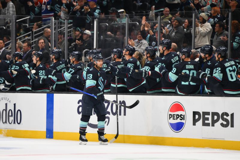 Oct 2, 2024; Seattle, Washington, USA; Seattle Kraken left wing Brandon Tanev (13) celebrates after scoring a goal against the Edmonton Oilers during the second period at Climate Pledge Arena. Mandatory Credit: Steven Bisig-Imagn Images