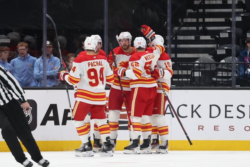 Oct 30, 2024; Salt Lake City, Utah, USA; The Calgary Flames celebrate a goal by right wing Anthony Mantha (39) against the Utah Hockey Club during the second period at Delta Center. Mandatory Credit: Rob Gray-Imagn Images