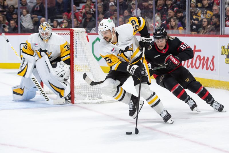 Dec 14, 2024; Ottawa, Ontario, CAN; Pittsburgh Penguins defenseman Erik Karlsson (65) skates with the puck in front of Ottawa Senators right wing Adam Gaudette (81) in the first period at the Canadian Tire Centre. Mandatory Credit: Marc DesRosiers-Imagn Images