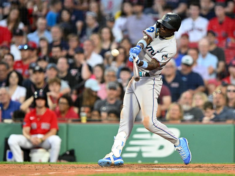 Jun 29, 2023; Boston, Massachusetts, USA; Miami Marlins center fielder Jazz Chisholm Jr. (2) hits a home run against the Boston Red Sox during the ninth inning at Fenway Park. Mandatory Credit: Brian Fluharty-USA TODAY Sports