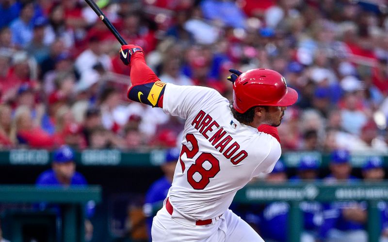 Apr 12, 2022; St. Louis, Missouri, USA;  St. Louis Cardinals third baseman Nolan Arenado (28) hits a two run home run against the Kansas City Royals during the first inning at Busch Stadium. Mandatory Credit: Jeff Curry-USA TODAY Sports