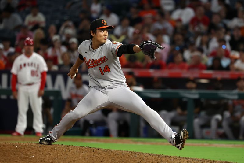 Sep 6, 2023; Anaheim, California, USA; Baltimore Orioles relief pitcher Shintaro Fujinami (14) pitches during the eighth inning against the Los Angeles Angels at Angel Stadium. Mandatory Credit: Kiyoshi Mio-USA TODAY Sports