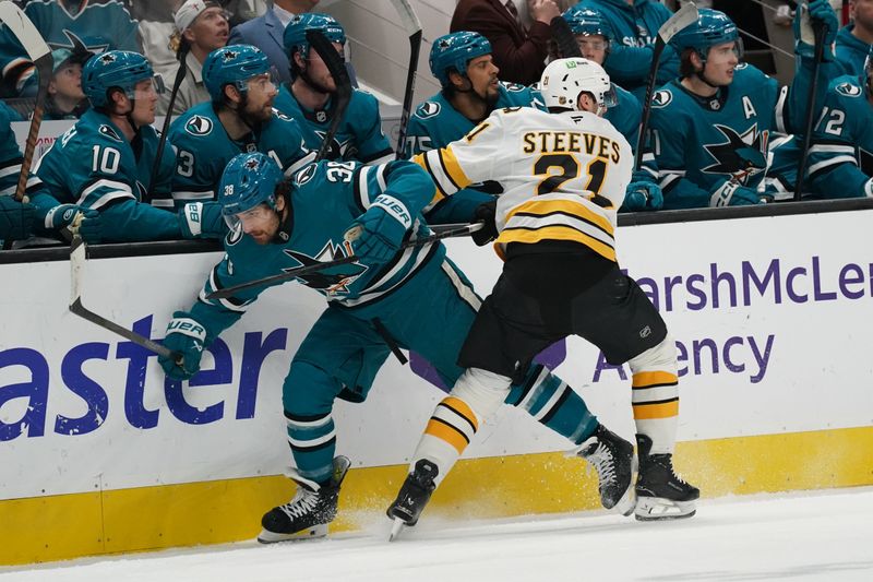Nov 23, 2025; San Jose, California, USA;  San Jose Sharks defenseman Mario Ferraro (38) and Boston Bruins center Alex Steeves (21) collide in the first period at SAP Center in San Jose. Mandatory Credit: David Gonzales-Imagn Images