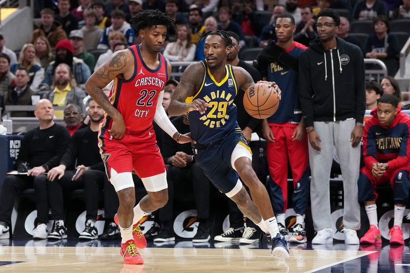 INDIANAPOLIS, INDIANA - NOVEMBER 25: Quenton Jackson #29 of the Indiana Pacers dribbles the ball while being guarded by Elfrid Payton #22 of the New Orleans Pelicans in the first quarter at Gainbridge Fieldhouse on November 25, 2024 in Indianapolis, Indiana. NOTE TO USER: User expressly acknowledges and agrees that, by downloading and or using this photograph, User is consenting to the terms and conditions of the Getty Images License Agreement. (Photo by Dylan Buell/Getty Images)