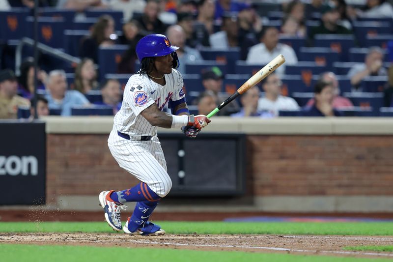 Sep 17, 2024; New York City, New York, USA; New York Mets shortstop Luisangel Acuna (2) follows through on an RBI double against the Washington Nationals during the third inning at Citi Field. Mandatory Credit: Brad Penner-Imagn Images