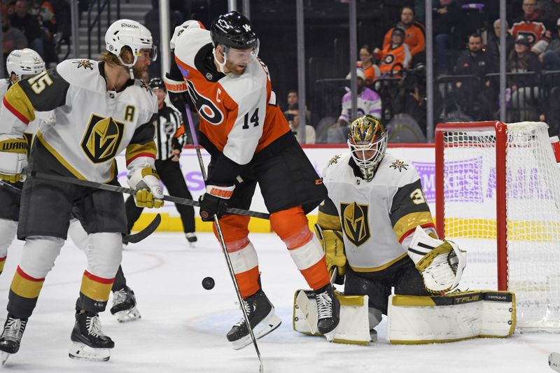 Nov 25, 2024; Philadelphia, Pennsylvania, USA; Philadelphia Flyers center Sean Couturier (14) battles for position with Vegas Golden Knights defenseman Noah Hanifin (15) in front of goaltender Ilya Samsonov (35) during the third period at Wells Fargo Center. Mandatory Credit: Eric Hartline-Imagn Images