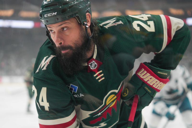 Mar 3, 2024; Saint Paul, Minnesota, USA; Minnesota Wild defenseman Zach Bogosian (24) plays the puck in his defensive zone against the San Jose Sharks in the first period at Xcel Energy Center. Mandatory Credit: Matt Blewett-USA TODAY Sports