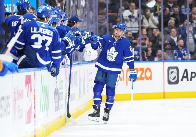 Mar 6, 2024; Toronto, Ontario, CAN; Toronto Maple Leafs right wing William Nylander (88) celebrates at the bench after scoring a goal against the Buffalo Sabres during the second period at Scotiabank Arena. Mandatory Credit: Nick Turchiaro-USA TODAY Sports