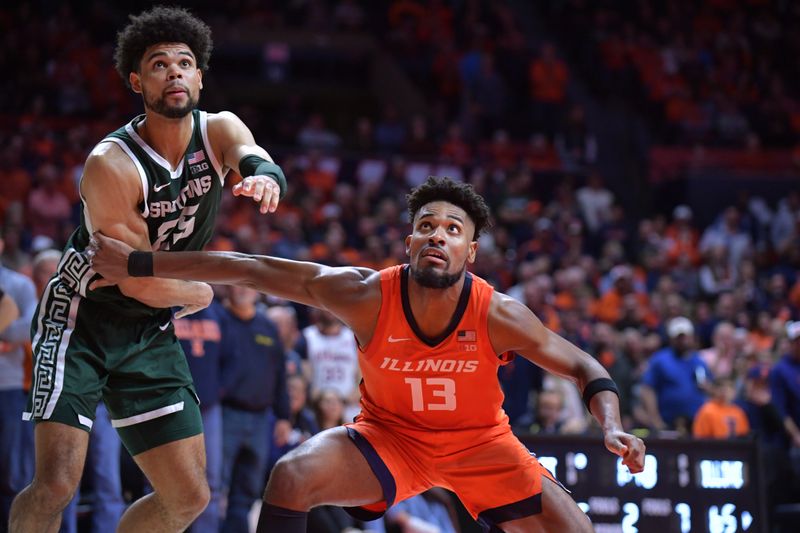 Jan 11, 2024; Champaign, Illinois, USA;  Illinois Fighting Illini forward Quincy Guerrier (13) and Michigan State Spartans forward Malik Hall (25) battle for position during the second half at State Farm Center. Mandatory Credit: Ron Johnson-USA TODAY Sports