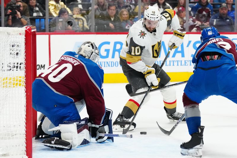 Jan 10, 2024; Denver, Colorado, USA; Vegas Golden Knights center Nicolas Roy (10) shoots the puck in Colorado Avalanche goaltender Alexandar Georgiev (40) in the first period at Ball Arena. Mandatory Credit: Ron Chenoy-USA TODAY Sports