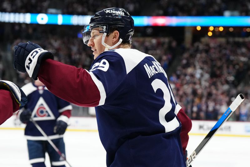 Feb 27, 2024; Denver, Colorado, USA;Colorado Avalanche center Nathan MacKinnon (29) celebrates his goal in the second period against the Dallas Stars at Ball Arena. Mandatory Credit: Ron Chenoy-USA TODAY Sports