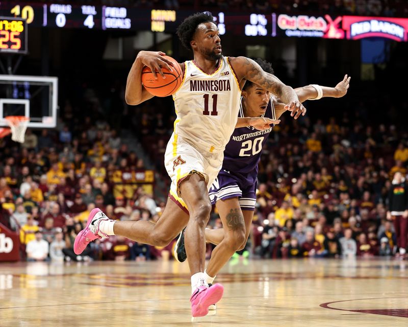 Feb 25, 2025; Minneapolis, Minnesota, USA; Minnesota Golden Gophers guard Femi Odukale (11) works around Northwestern Wildcats guard Justin Mullins (20) during the first half at Williams Arena. Mandatory Credit: Matt Krohn-Imagn Images