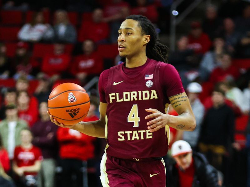 Feb 1, 2023; Raleigh, North Carolina, USA; Florida State Seminoles guard Caleb Mills (4) dribbles during the second half against North Carolina State Wolfpack at PNC Arena.  Mandatory Credit: Jaylynn Nash-USA TODAY Sports