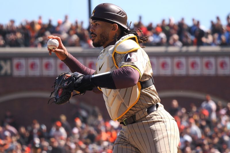 Apr 5, 2024; San Francisco, California, USA; San Diego Padres catcher Luis Campusano (12) chases down a San Francisco Giants runner during the fourth inning at Oracle Park. Mandatory Credit: Kelley L Cox-USA TODAY Sports