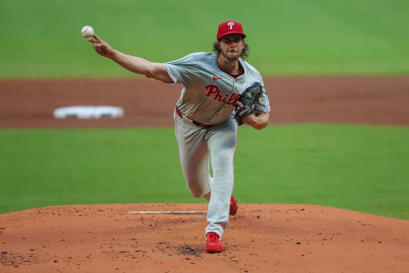 Jul 5, 2024; Atlanta, Georgia, USA; Philadelphia Phillies starting pitcher Aaron Nola (27) throws against the Atlanta Braves in the first inning at Truist Park. Mandatory Credit: Brett Davis-USA TODAY Sports