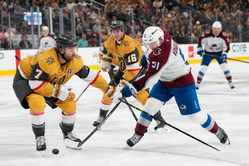 Oct 9, 2024; Las Vegas, Nevada, USA; Colorado Avalanche right wing Nikolai Kovalenko (51) shoots the puck against Vegas Golden Knights defenseman Alex Pietrangelo (7) and left wing Pavel Dorofeyev (16) during the third period at T-Mobile Arena. Mandatory Credit: Lucas Peltier-Imagn Images