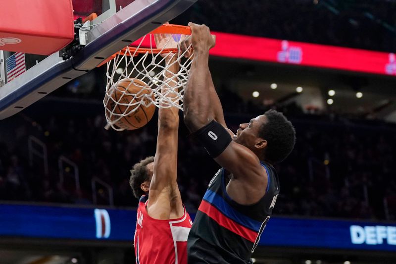 WASHINGTON, DC - MARCH 29: Jalen Duren #0 of the Detroit Pistons dunks against Patrick Baldwin Jr. #7 of the Washington Wizards during the first half at Capital One Arena on March 29, 2024 in Washington, DC. NOTE TO USER: User expressly acknowledges and agrees that, by downloading and or using this photograph, User is consenting to the terms and conditions of the Getty Images License Agreement. (Photo by Jess Rapfogel/Getty Images)