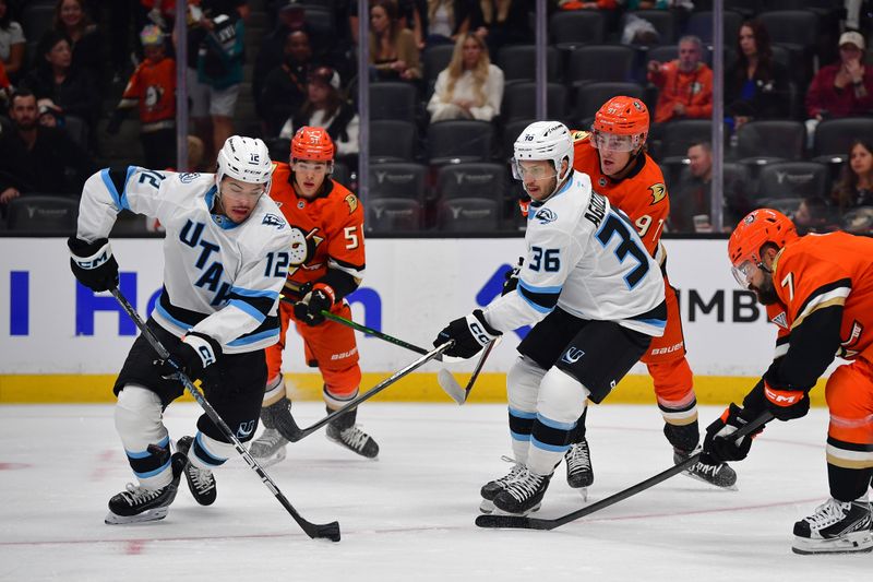 Sep 22, 2025; Anaheim, California, USA; Utah Mammoth center Tij Iginla (12) moves the puck against the Anaheim Ducks during the first period at Honda Center. Mandatory Credit: Gary A. Vasquez-Imagn Images