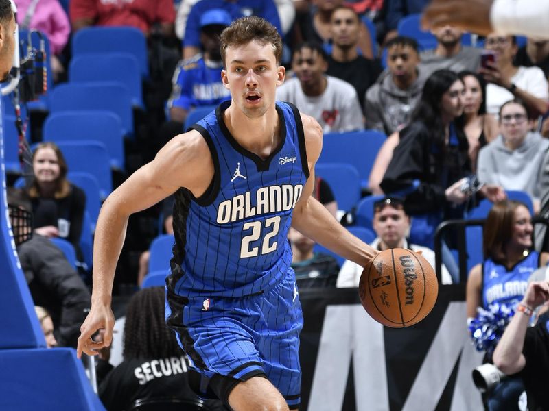 ORLANDO, FL - APRIL 1: Franz Wagner #22 of the Orlando Magic handles the ball during the game against the Portland Trail Blazers on April 1, 2024 at Kia Center in Orlando, Florida. NOTE TO USER: User expressly acknowledges and agrees that, by downloading and or using this photograph, User is consenting to the terms and conditions of the Getty Images License Agreement. Mandatory Copyright Notice: Copyright 2024 NBAE (Photo by Fernando Medina/NBAE via Getty Images)