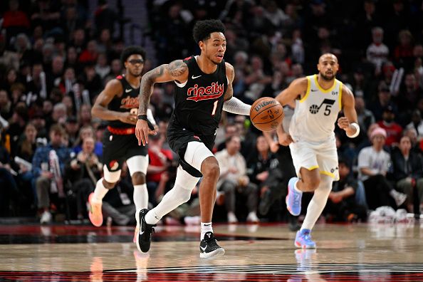 PORTLAND, OREGON - DECEMBER 14: Anfernee Simons #1 of the Portland Trail Blazers dribbles during the third quarter of the game against the Utah Jazz at Moda Center on December 14, 2023 in Portland, Oregon. The Utah Jazz won 122-114. NOTE TO USER: User expressly acknowledges and agrees that, by downloading and or using this Photograph, user is consenting to the terms and conditions of the Getty Images License Agreement. (Photo by Alika Jenner/Getty Images)