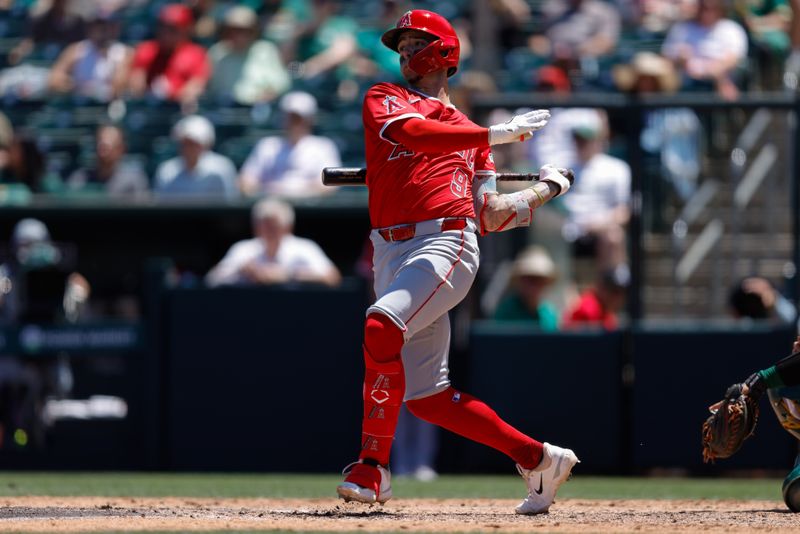 May 22, 2025; West Sacramento, California, USA; Los Angeles Angels shortstop Zach Neto (9) hits an RBI double during the fifth inning against the Athletics at Sutter Health Park. Mandatory Credit: Sergio Estrada-Imagn Images
