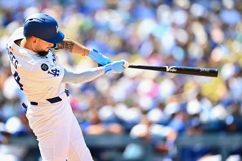Jul 20, 2025; Los Angeles, California, USA; Los Angeles Dodgers outfielder Andy Pages (44) hits the ball into play against the Milwaukee Brewers in the during the seventh inning at Dodger Stadium. Mandatory Credit: Jonathan Hui-Imagn Images