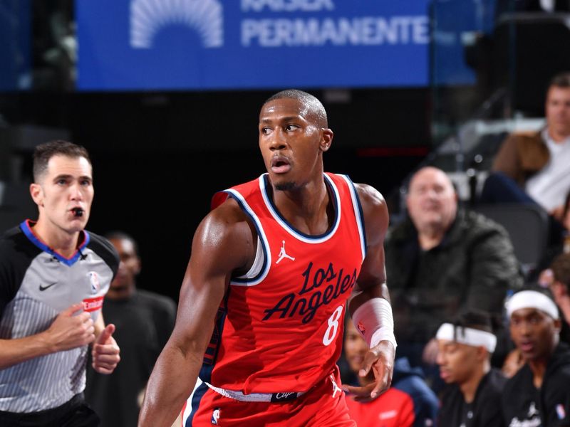 INGLEWOOD, CA - DECEMBER 3: Kris Dunn #8 of the LA Clippers dribbles the ball during the game against the Portland Trail Blazers on December 3, 2024 at Intuit Dome in Los Angeles, California. NOTE TO USER: User expressly acknowledges and agrees that, by downloading and/or using this Photograph, user is consenting to the terms and conditions of the Getty Images License Agreement. Mandatory Copyright Notice: Copyright 2024 NBAE (Photo by Juan Ocampo/NBAE via Getty Images)