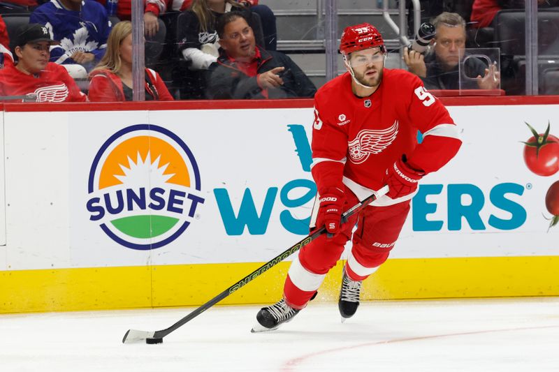 Oct 3, 2024; Detroit, Michigan, USA;  Detroit Red Wings right wing Alex DeBrincat (93) skates with the puck against the Toronto Maple Leafs at Little Caesars Arena. Mandatory Credit: Rick Osentoski-Imagn Images