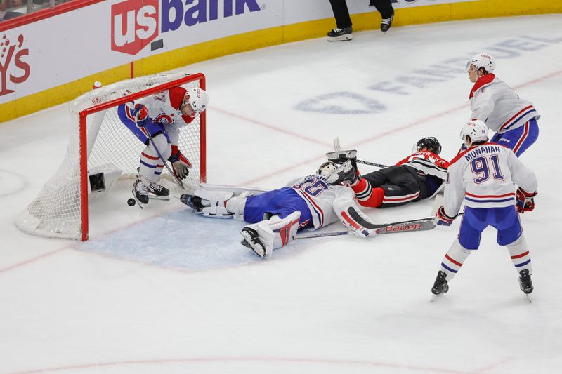 Dec 22, 2023; Chicago, Illinois, USA; Montreal Canadiens defenseman Jayden Struble (47) defends a shot by Chicago Blackhawks left wing Anthony Beauvillier (91) during the first period at United Center. Mandatory Credit: Kamil Krzaczynski-USA TODAY Sports